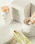 Skincare products with 'ALMISE' branding on a neutral background